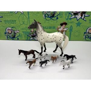 Lot of 8 Toy Horses - Different Sizes all In Good condition.